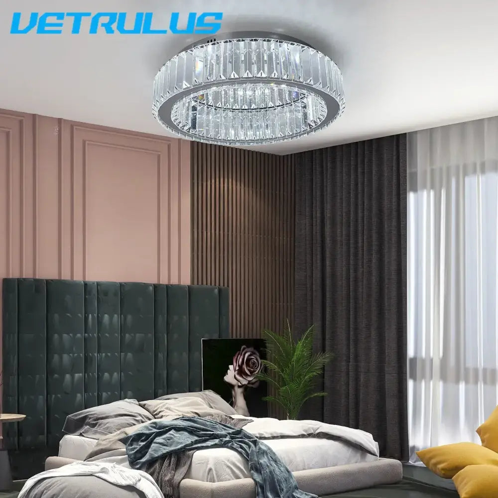 A modern silver big crystal led ceiling lamp with a circular design and faceted glass by Vetrulus for living room