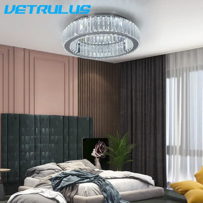 A modern silver big crystal led ceiling lamp with a circular design and faceted glass by Vetrulus for living room