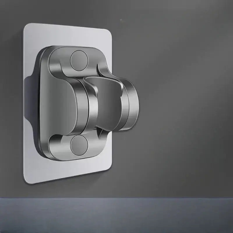Silver metallic wall-mounted shower holder bracket with sleek modern design and rounded edges for bathroom use