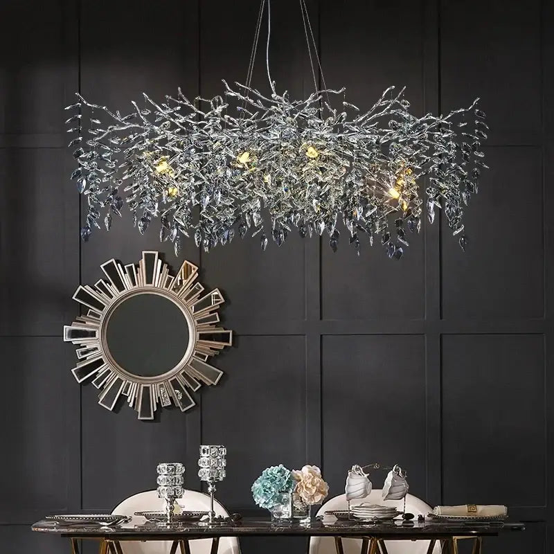 Modern silver and black crystal chrome chandelier with shimmering silver branches and warm embedded lights for living room