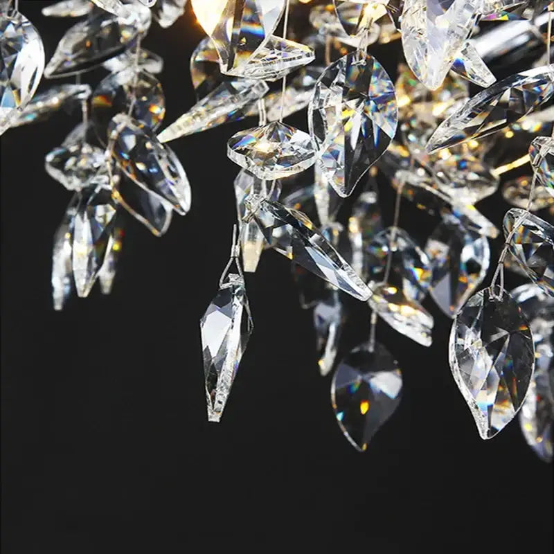 Modern silver and black crystal chrome chandelier with faceted teardrop glass pieces for living room lighting