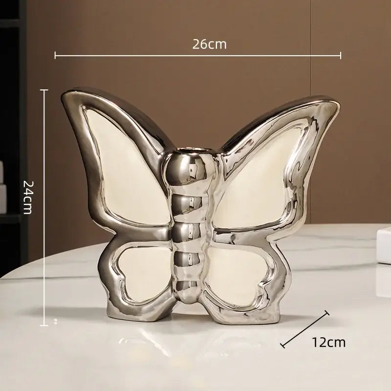 Shiny silver butterfly ceramic vase with glossy finish and cream interior for modern living room decor