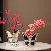 Two silver black and white butterfly ceramic vases featuring red butterflies and pink orchids for living room decor