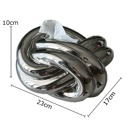 Modern silver ceramic knot tissue box with shiny chrome finish designed as intricate decorbites ceramic knot decor