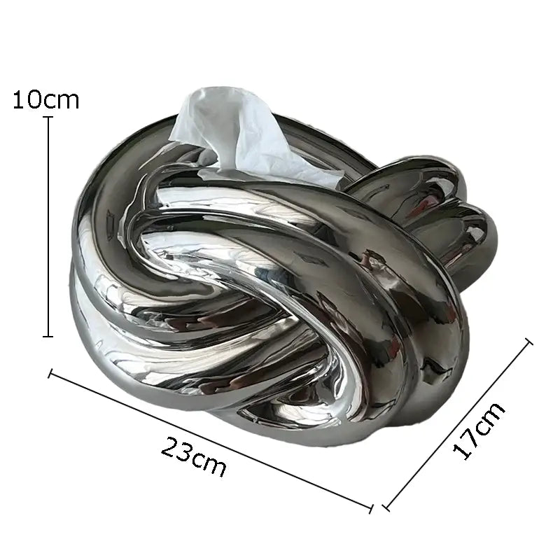 Modern silver ceramic knot tissue box with shiny chrome finish designed as intricate decorbites ceramic knot decor