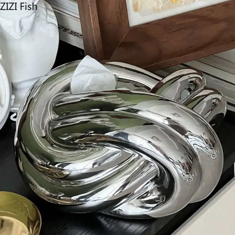 Modern silver ceramic knot tissue box with shiny metallic twisted knot design for living room decorbites ceramic knot decor