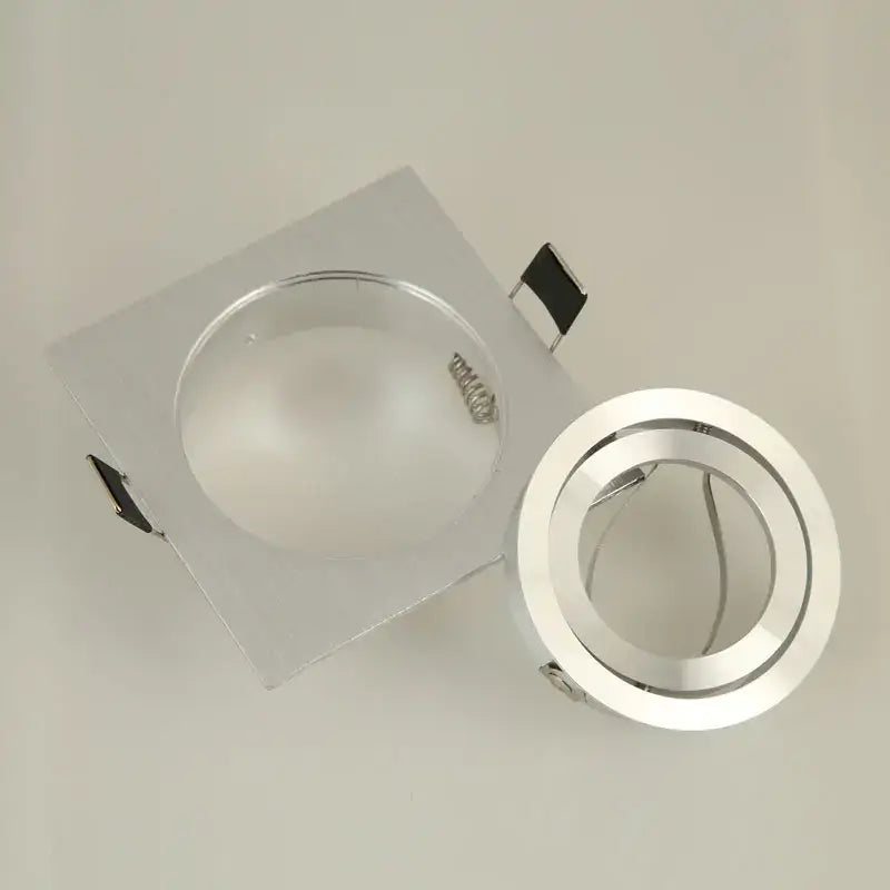 Modern silver and chrome square ceiling downlight frame with frosted glass lens and adjustable ring for living room use