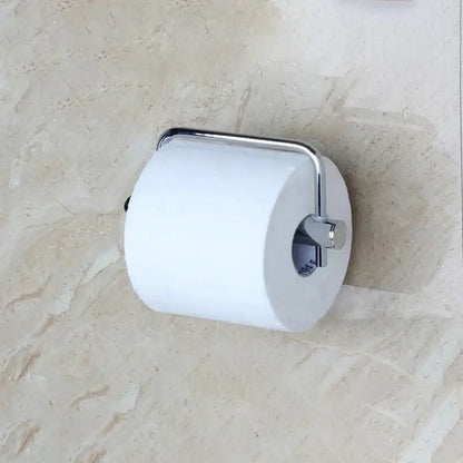 A sleek modern silver chrome paper holder cradles a white toilet paper roll by decorbites euro silver