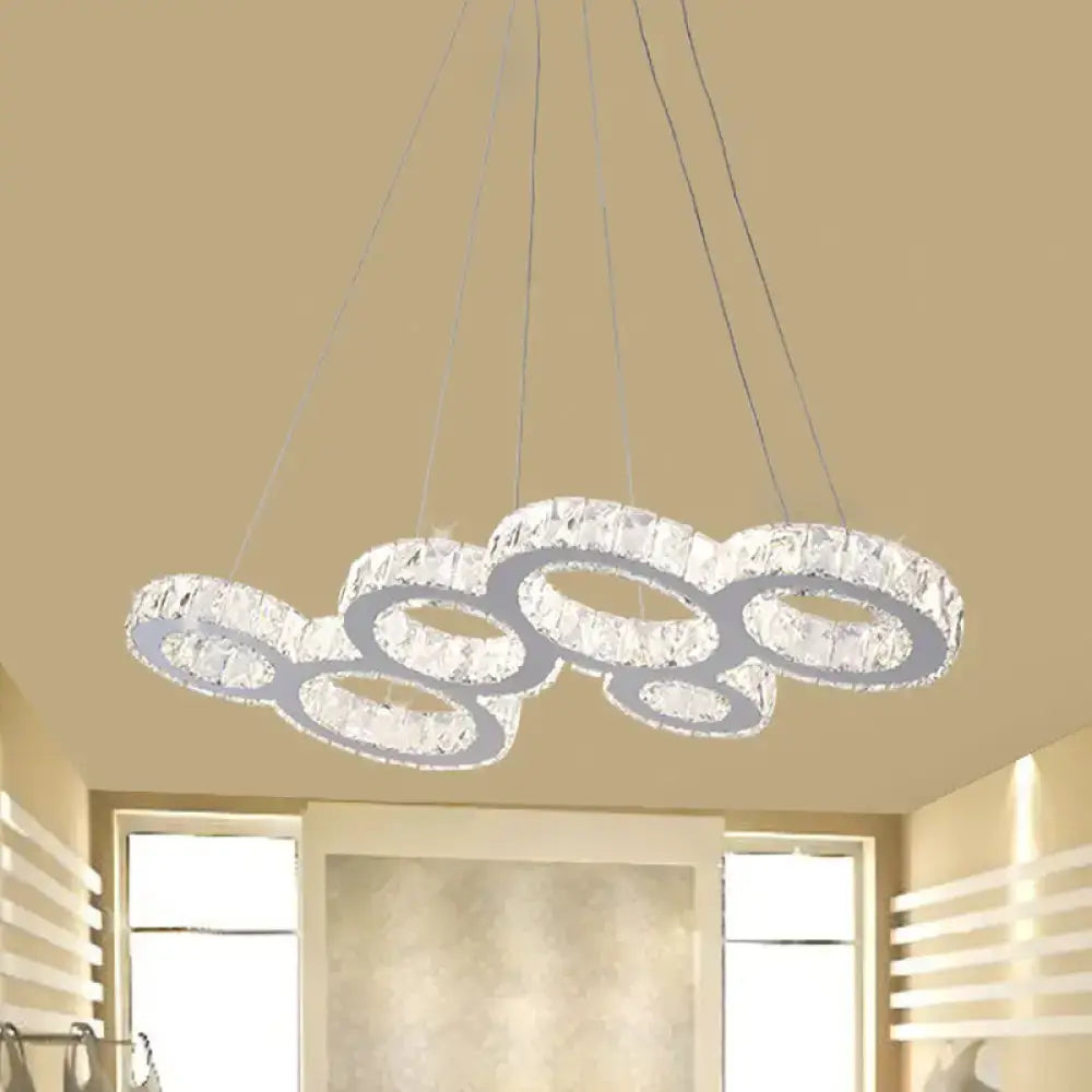Modern crystal bubble led pendant with interconnected circular rings clear crystals and stainless steel frame over island