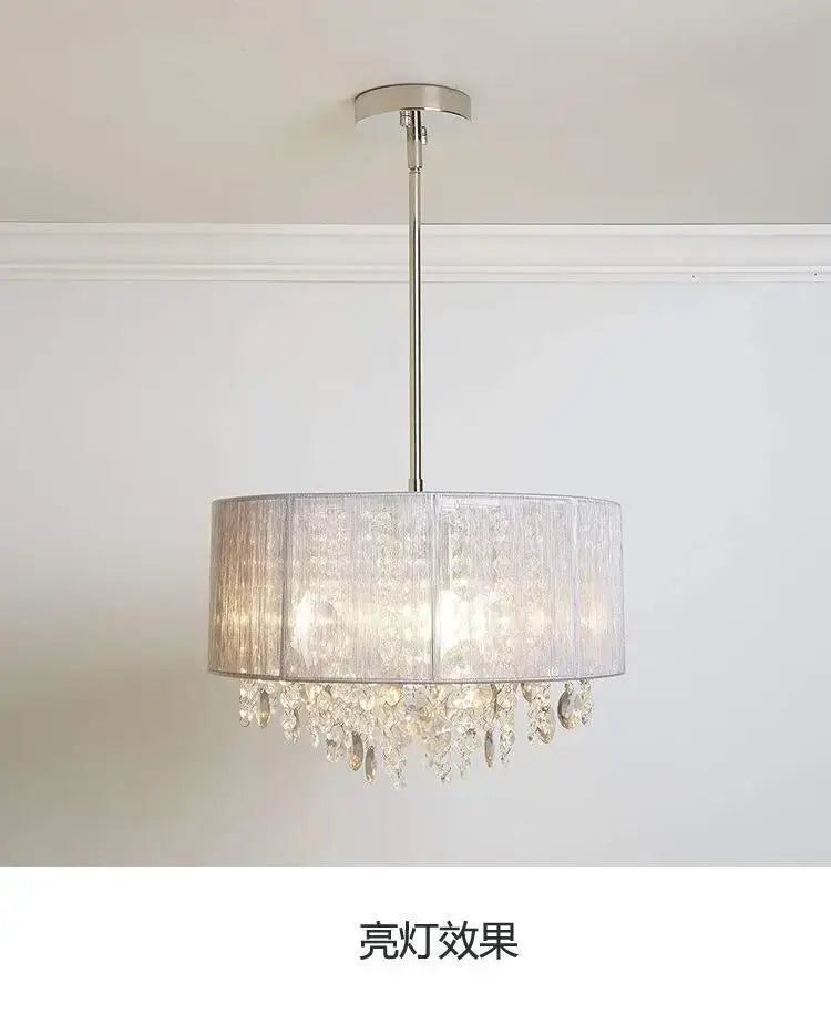 A modern silver crystal fabric pendant lamp with a translucent gray shade and clear crystal droplets for bedroom decorbites crystal fabric