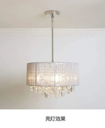 A modern silver crystal fabric pendant lamp with a translucent gray shade and clear crystal droplets for bedroom decorbites crystal fabric