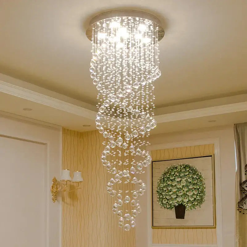 Modern silver crystal led chandelier with cascading clear faceted beads and circular metallic base by decorbites crystal led