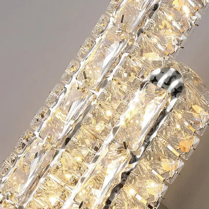 Modern silver crystal led wall lamp with cascading clear faceted prisms in sleek chrome frame for bedroom decorbites crystal led
