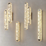 Modern silver crystal led wall lamp with elongated design and warm golden glow for bedroom decorbites crystal led lighting