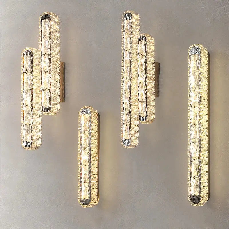 Modern silver crystal led wall lamp with elongated design and warm golden glow for bedroom decorbites crystal led lighting