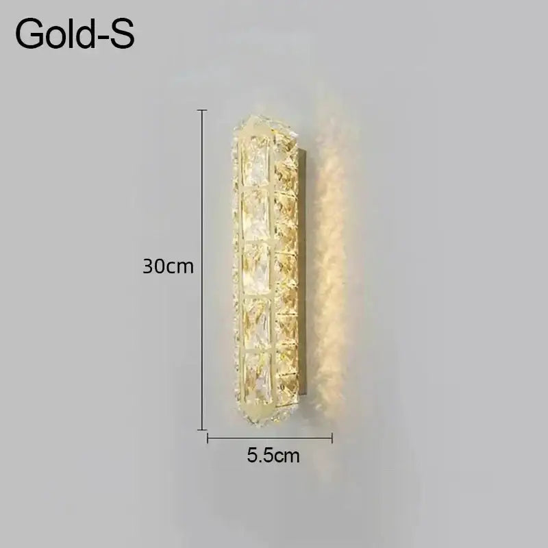 Gold sconce with sleek rectangular design and embedded crystal panels emitting warm glow for decorbites crystal led lamp