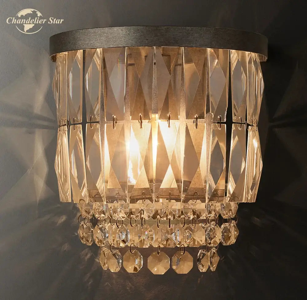 Modern silver crystal led wall sconce with dark metal frame and clear glass prisms for elegant living room decorbites crystal led wall