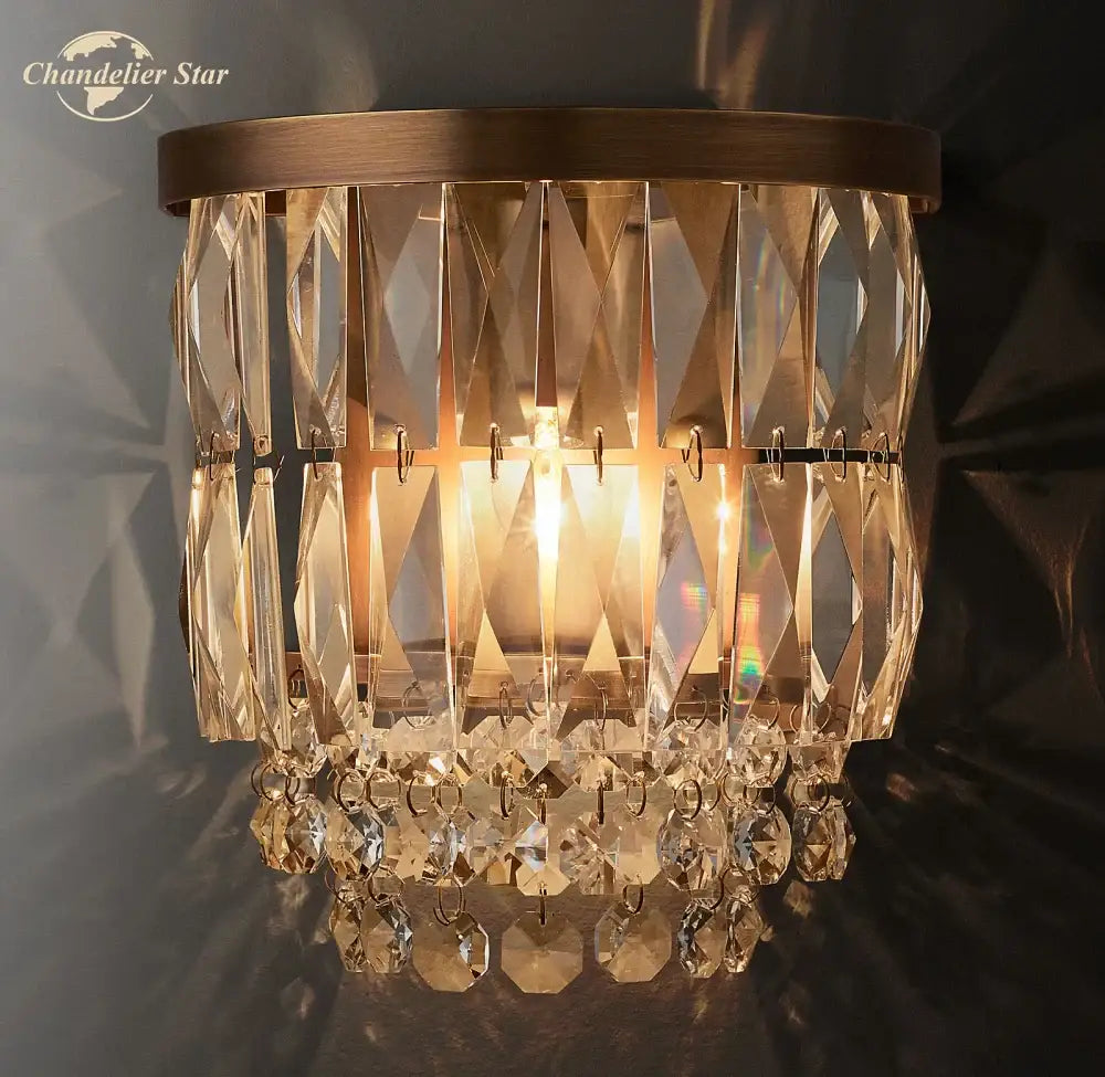 Modern silver crystal led wall sconce with brass finish, cascading faceted prisms, and teardrop crystals for living room decorbites crystal led lighting