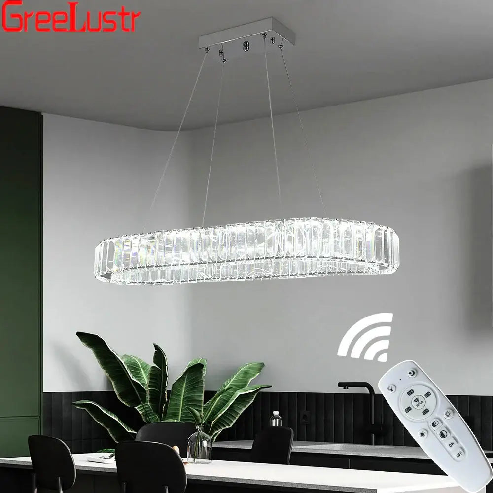 Modern silver led chandelier featuring a sleek oval crystal oval design with a silver-toned metal frame for living room decor