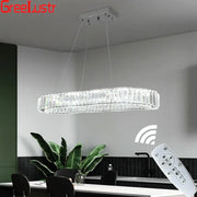 Modern silver led chandelier featuring a sleek oval crystal oval design with a silver-toned metal frame for living room decor