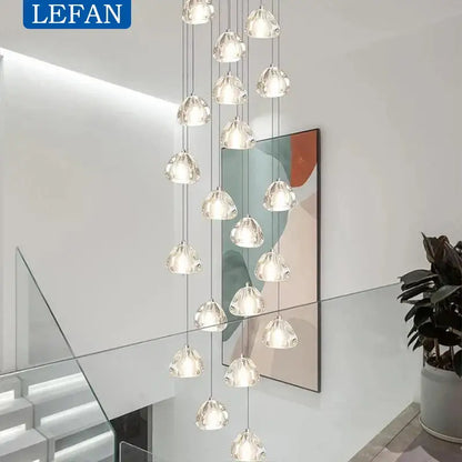 A modern silver crystal pendant light with multiple clear glass bubbles in a cascading cord pendant installation