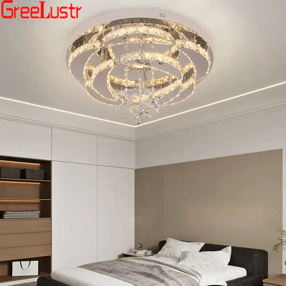 Modern silver crystal raindrop led chandelier ceiling light with concentric clear crystal rings and metallic accents for decorbites decor