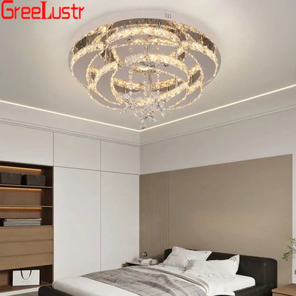 Modern silver crystal raindrop led chandelier ceiling light with concentric clear crystal rings and metallic accents for decorbites decor