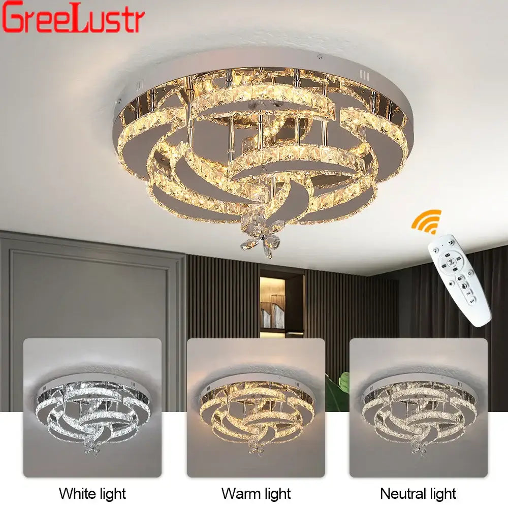Modern silver crystal raindrop led chandelier ceiling light with swirling rings and butterfly accent in white warm or neutral light