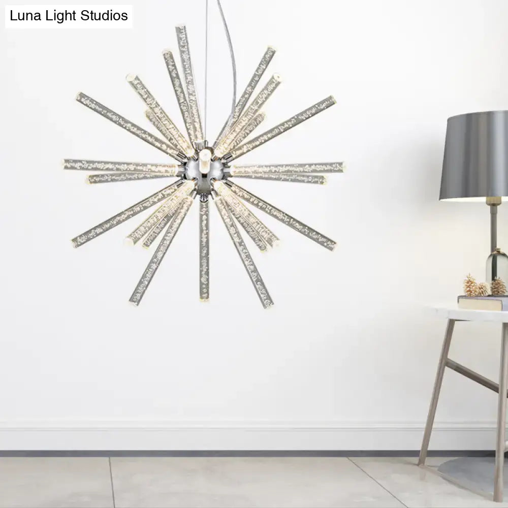 Silver starburst chandelier pendant with clear crystal rods radiating from a central chrome fixture for hanging ceiling use