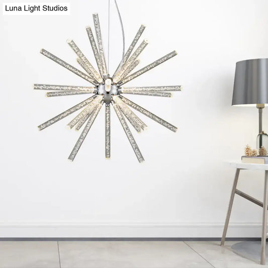 Silver starburst chandelier pendant with clear crystal rods radiating from a central chrome fixture for hanging ceiling use