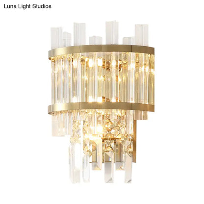Modern gold-toned wall mounted fixture with cascading clear crystal rods and tiered geometric accents for wall light use