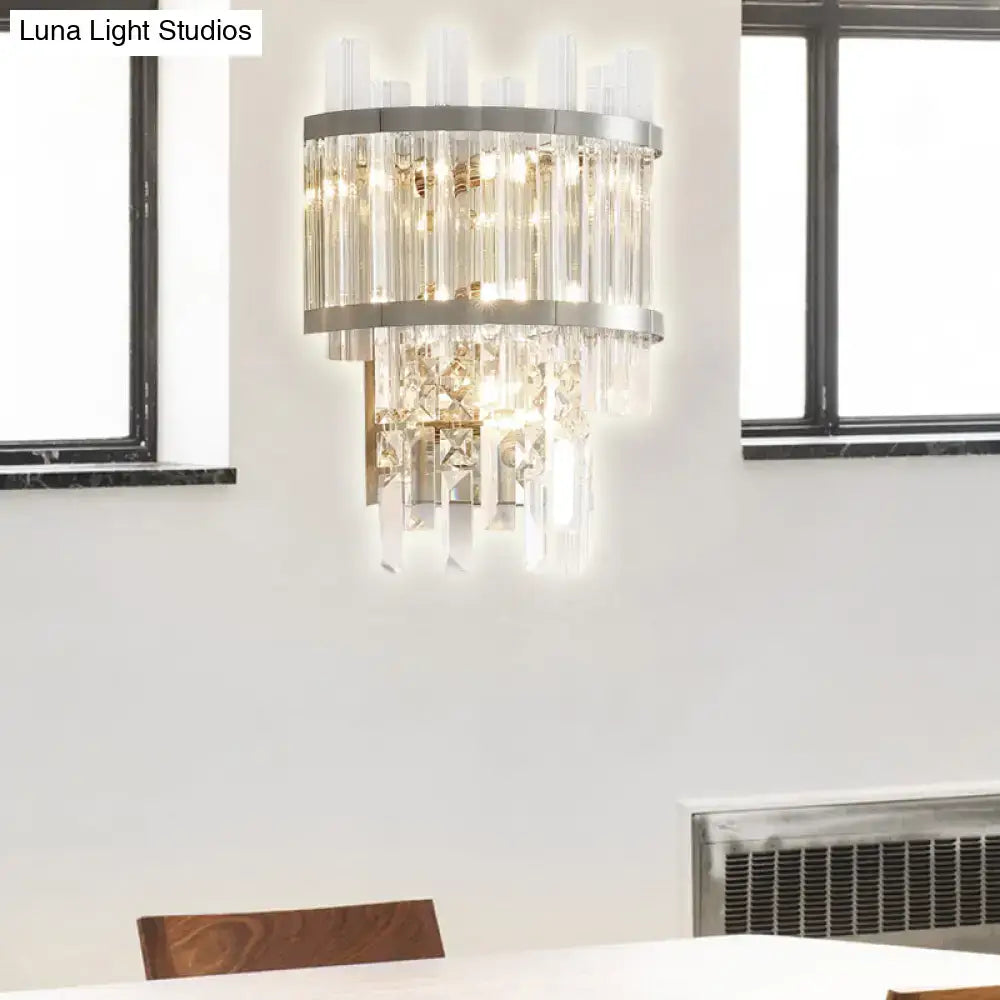 Modern silver wall light featuring two-tiered clear crystal rods and a sleek metal frame, ideal wall mounted fixture width