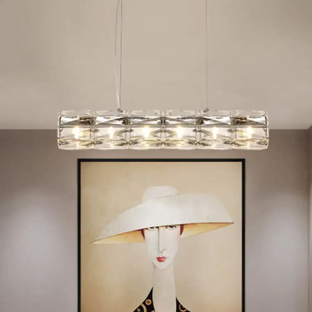 Modern silver crystal tube island light with a sleek metal frame and multiple embedded lights for dining rooms