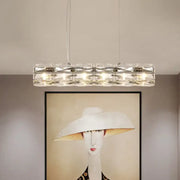 Modern silver crystal tube island light with a sleek metal frame and multiple embedded lights for dining rooms