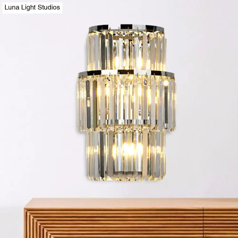 Modern silver crystal three-tiered wall mounted light with faceted clear glass rods and polished chrome accents