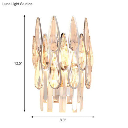 Modern silver crystal wall sconce with teardrop prisms in polished chrome for elegant living room double layer lighting