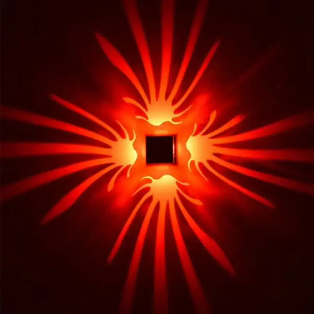 Modern silver cube led wall sconce with bulb included glowing red and orange casting flame-like patterns for corridor lighting