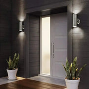 Modern silver cylindrical wall sconces made of metal with a sleek minimalist design for outdoor lighting