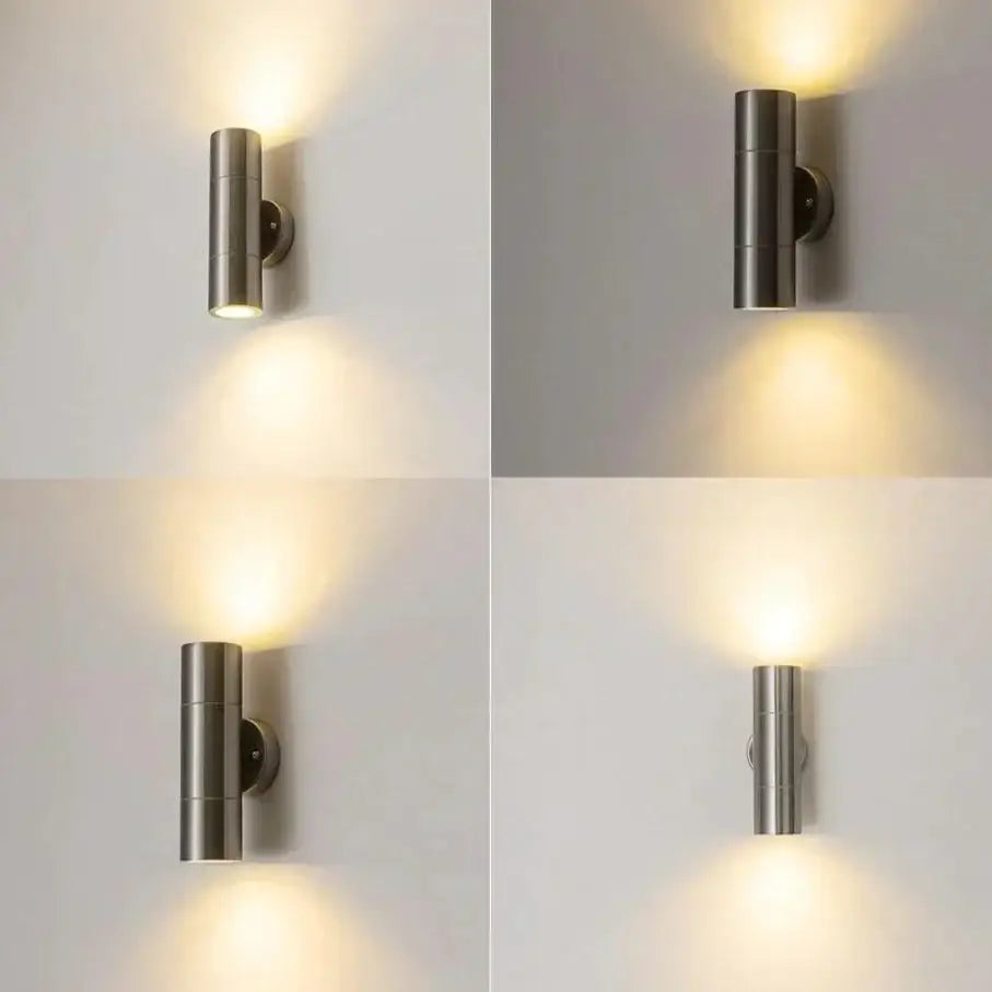 Modern silver cylindrical brushed stainless steel wall sconce with dual downward-facing lights for outdoor use