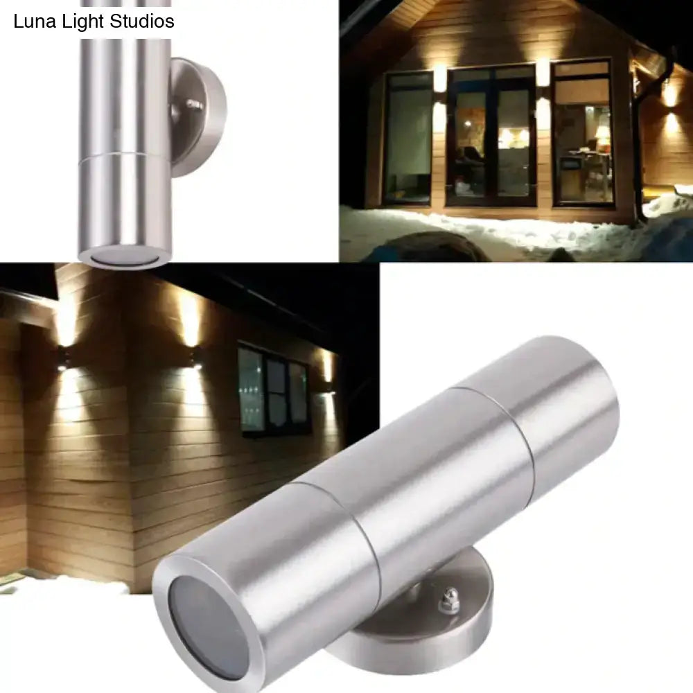 Modern silver stainless steel cylindrical outdoor wall-mounted spotlight with sleek minimalist design