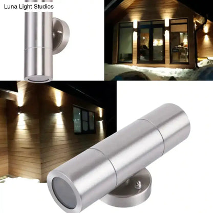 Modern silver stainless steel cylindrical outdoor wall-mounted spotlight with sleek minimalist design