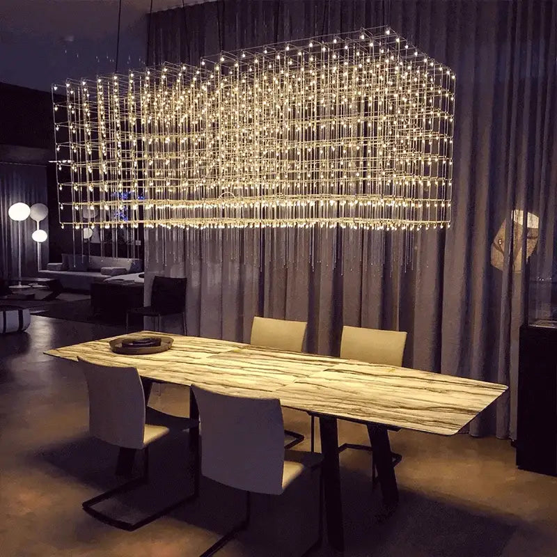 A modern silver decorbites cosmos chandelier with a rectangular metal frame and warm led lights for dining rooms