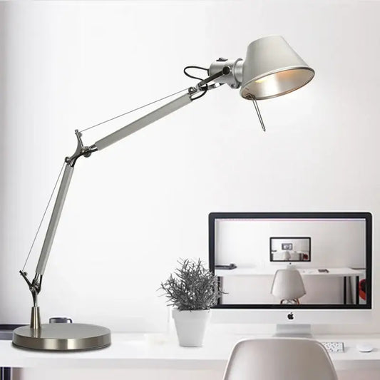 Modern silver double arm clip table lamp with a sleek adjustable matte-finished shade for bedroom desk use