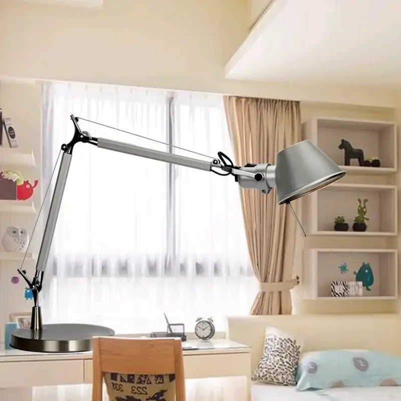 Adjustable silver table lamp with double arm clip and matte finish shade for bedroom or desk use