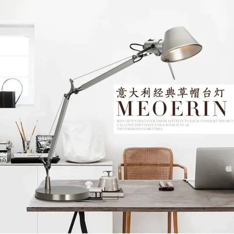 Modern silver double arm clip table lamp with adjustable silver metallic shade and articulated arm for desk lighting
