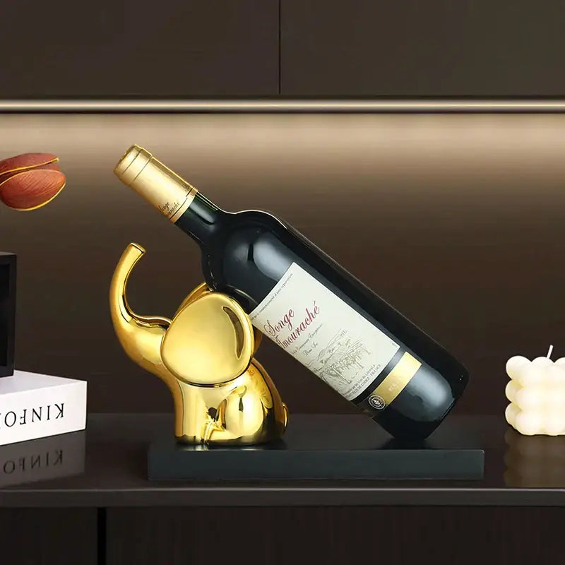 Golden elephant-shaped wine rack table ornament with sleek polished finish for dining room wine rack display