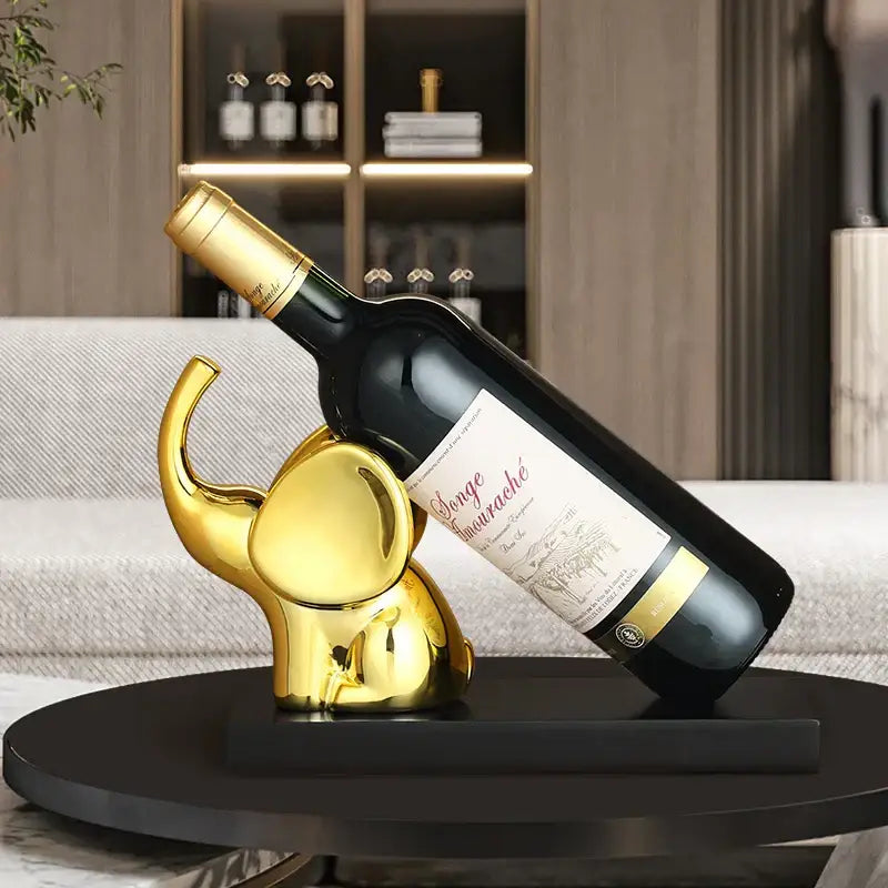 Golden elephant-shaped wine rack table ornament with a sleek reflective finish for dining room display