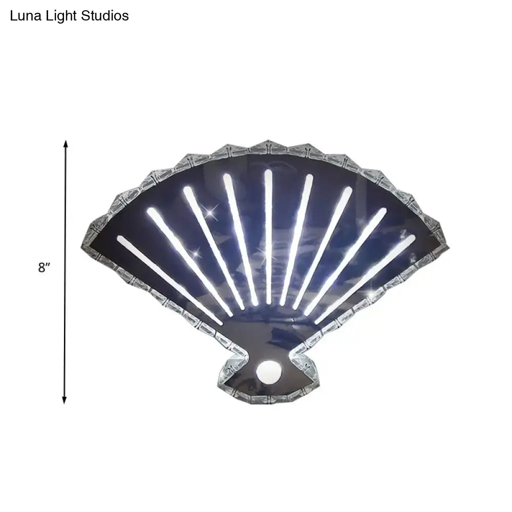 Modern silver fan wall lamp with scalloped led light features shiny silver shell design and glowing white vertical strips