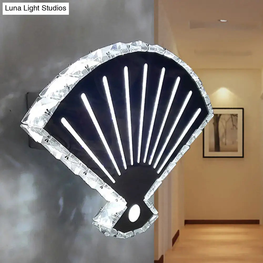 Modern black fan wall lamp designed as a sleek shell shape with crystal border and white led strips for bedroom use