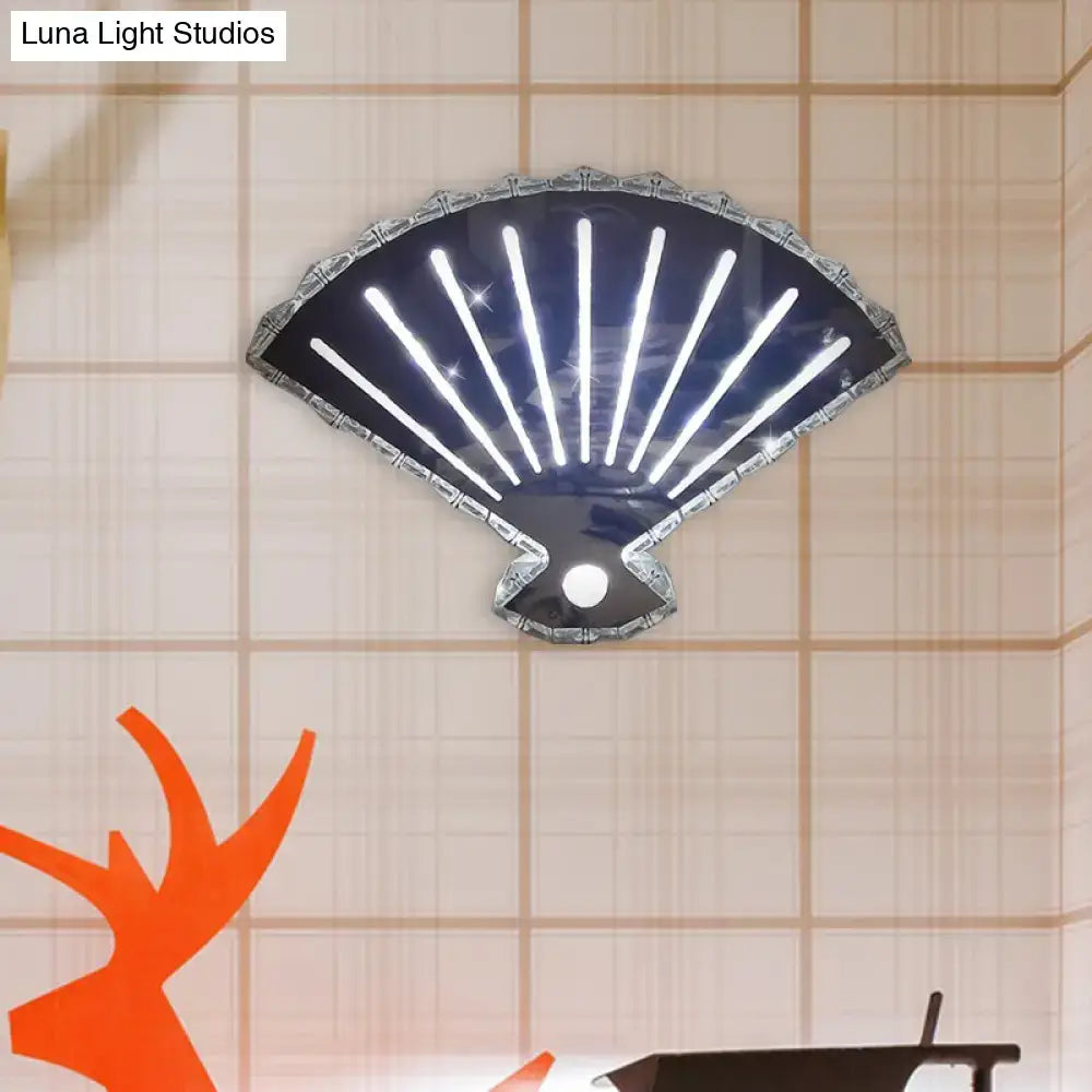 Modern silver fan wall lamp with a sleek black fan shell shape and radiant white led strips for bedroom lighting